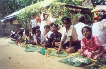 Children having prasad inside the asrama premises during the
